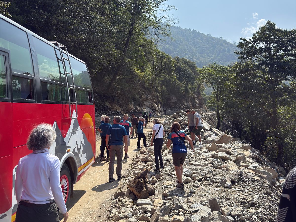 Trekkers taking a short break to enjoy the view on the way to Syabrubesi.