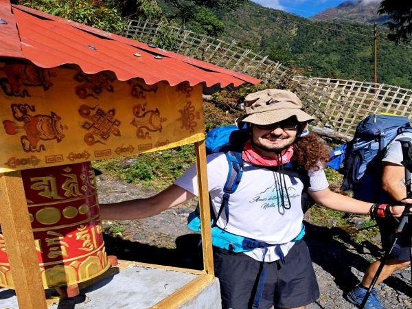 Trekkers Enjoy Buddhist Pray Wheel Piek Peak Trek